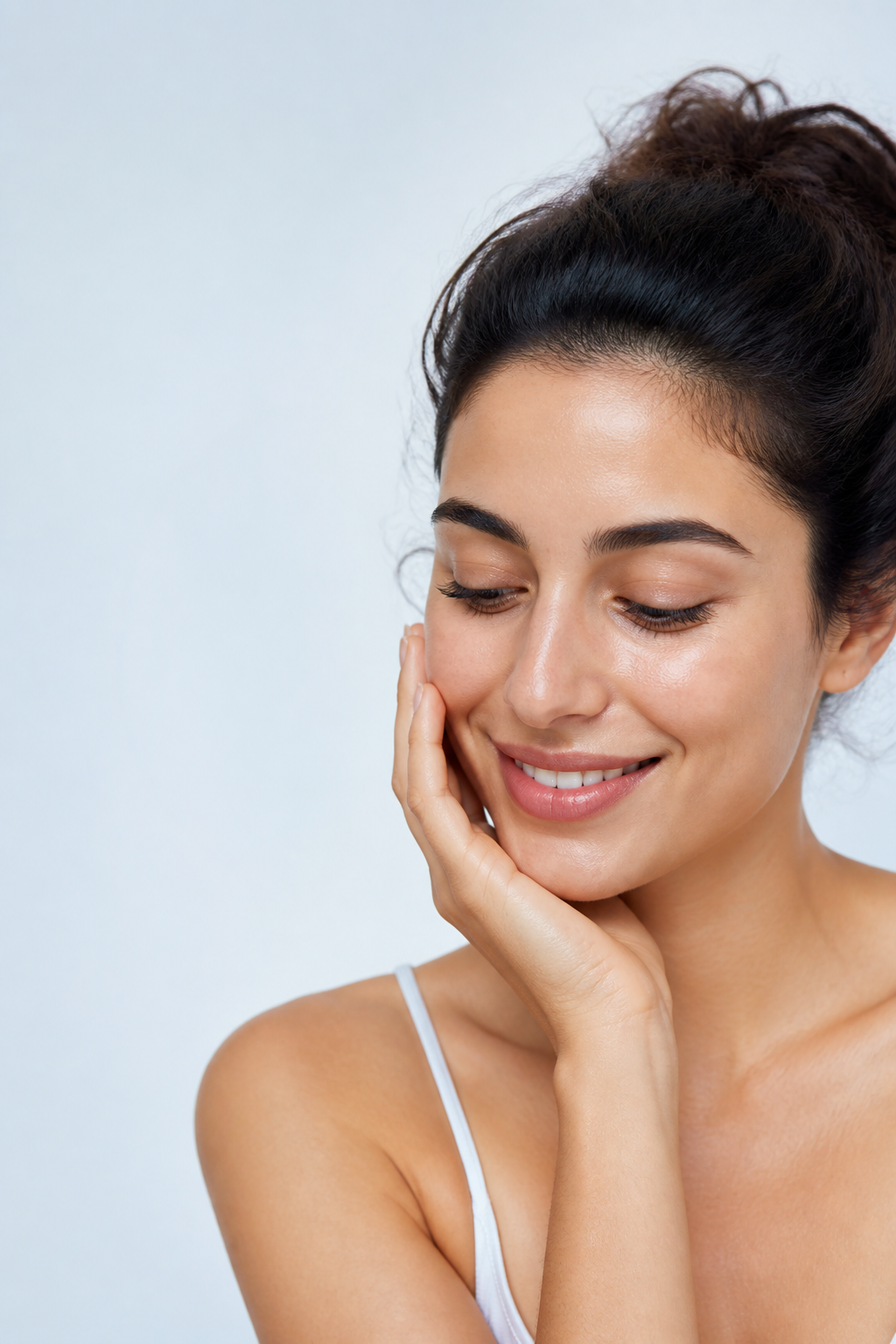 Woman with naturally healthy skin enjoying a gentle skin-care moment